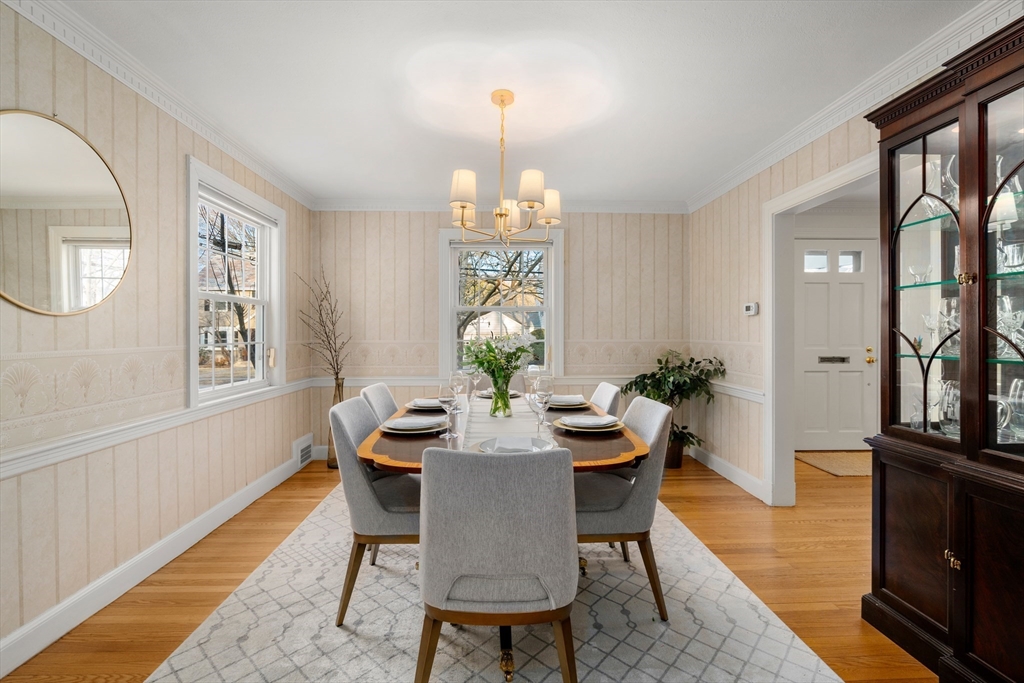 21 Sheldon Road Newton, MA 02459 - Photo 11 of 34 a view of a dining room with furniture a chandelier and wooden floor