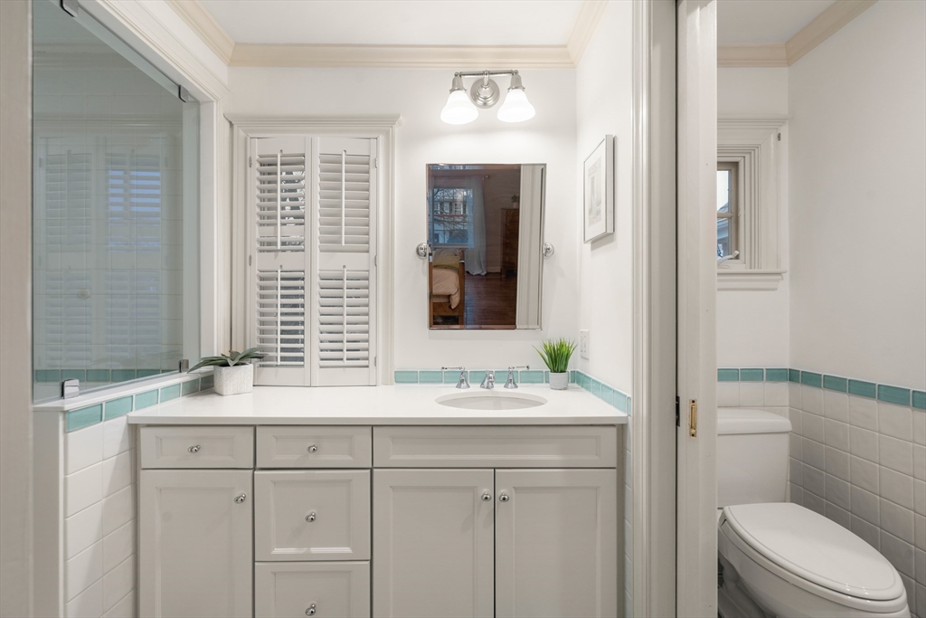21 Sheldon Road Newton, MA 02459 - Photo 22 of 34 a bathroom with a sink and a mirror