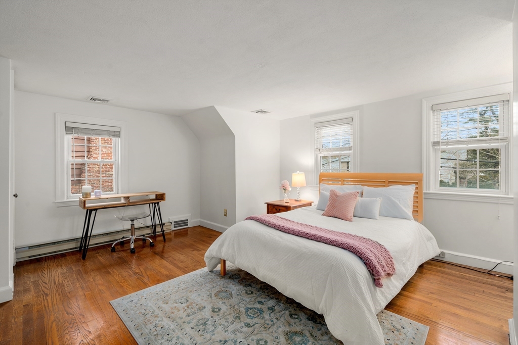 21 Sheldon Road Newton, MA 02459 - Photo 26 of 34 a bedroom with a bed a table and windows