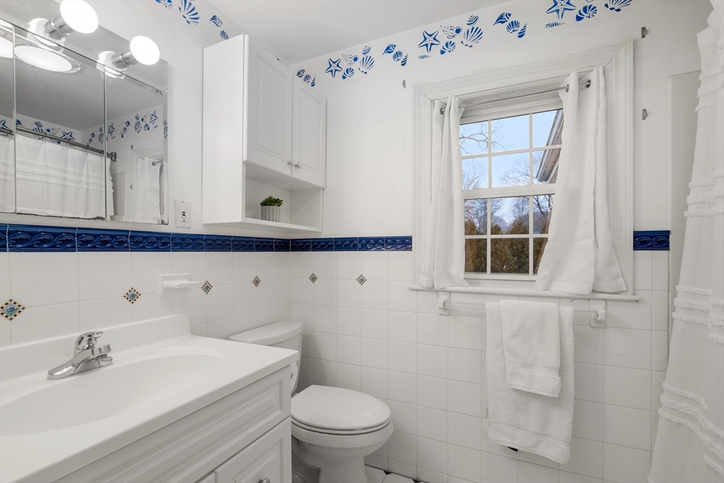 21 Sheldon Road Newton, MA 02459 - Photo 27 of 34 a bathroom with a sink vanity granite and toilet