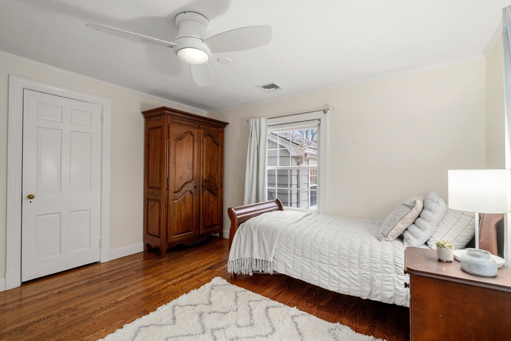 21 Sheldon Road Newton, MA 02459 - Photo 29 of 34 a bedroom with a bed and wooden floor
