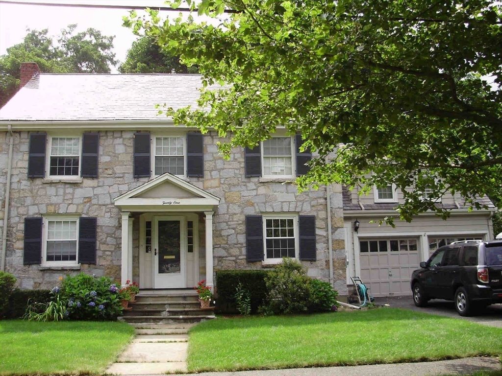 21 Sheldon Road Newton, MA 02459 - Photo 3 of 34 a front view of a house with a garden and trees