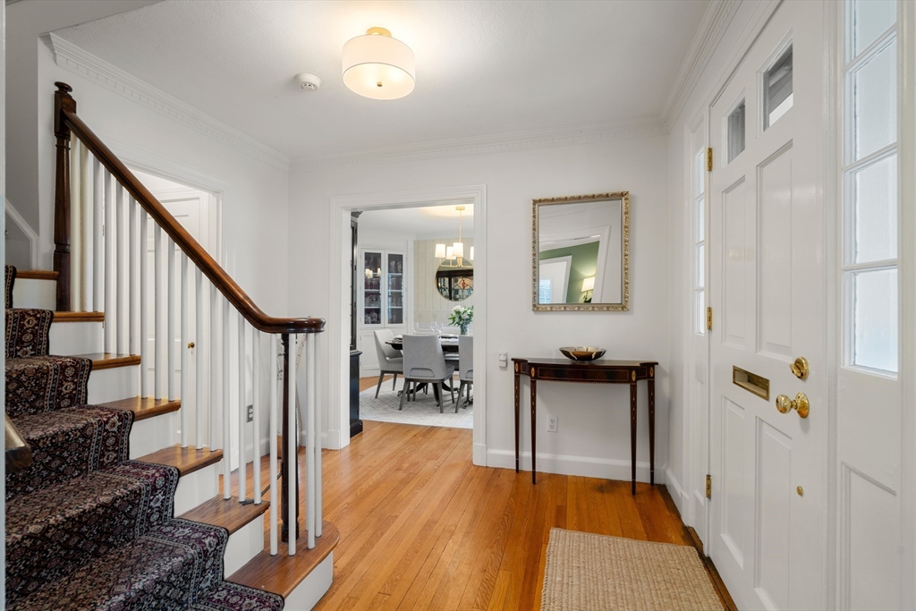 21 Sheldon Road Newton, MA 02459 - Photo 4 of 34 a hallway with wooden floor furniture and a entryway
