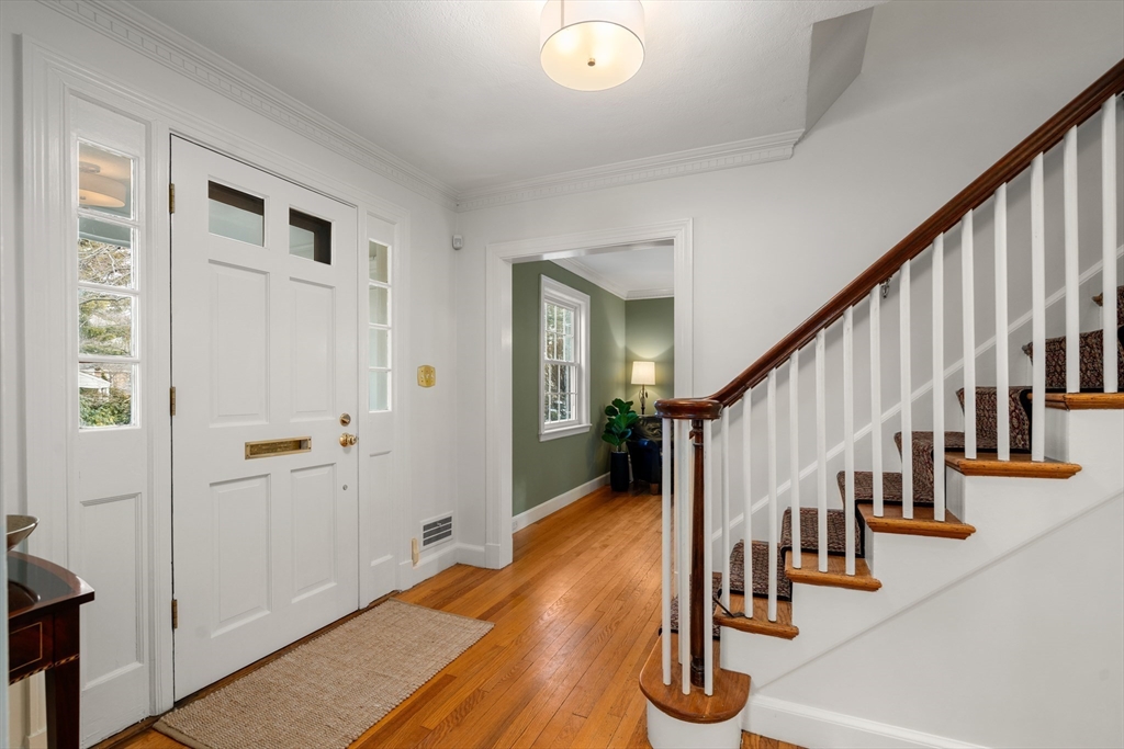 21 Sheldon Road Newton, MA 02459 - Photo 6 of 34 a hallway with wooden floor and windows