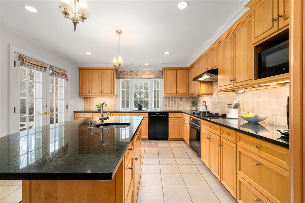 21 Sheldon Road Newton, MA 02459 - Photo 9 of 34 a large kitchen with kitchen island granite countertop a large window