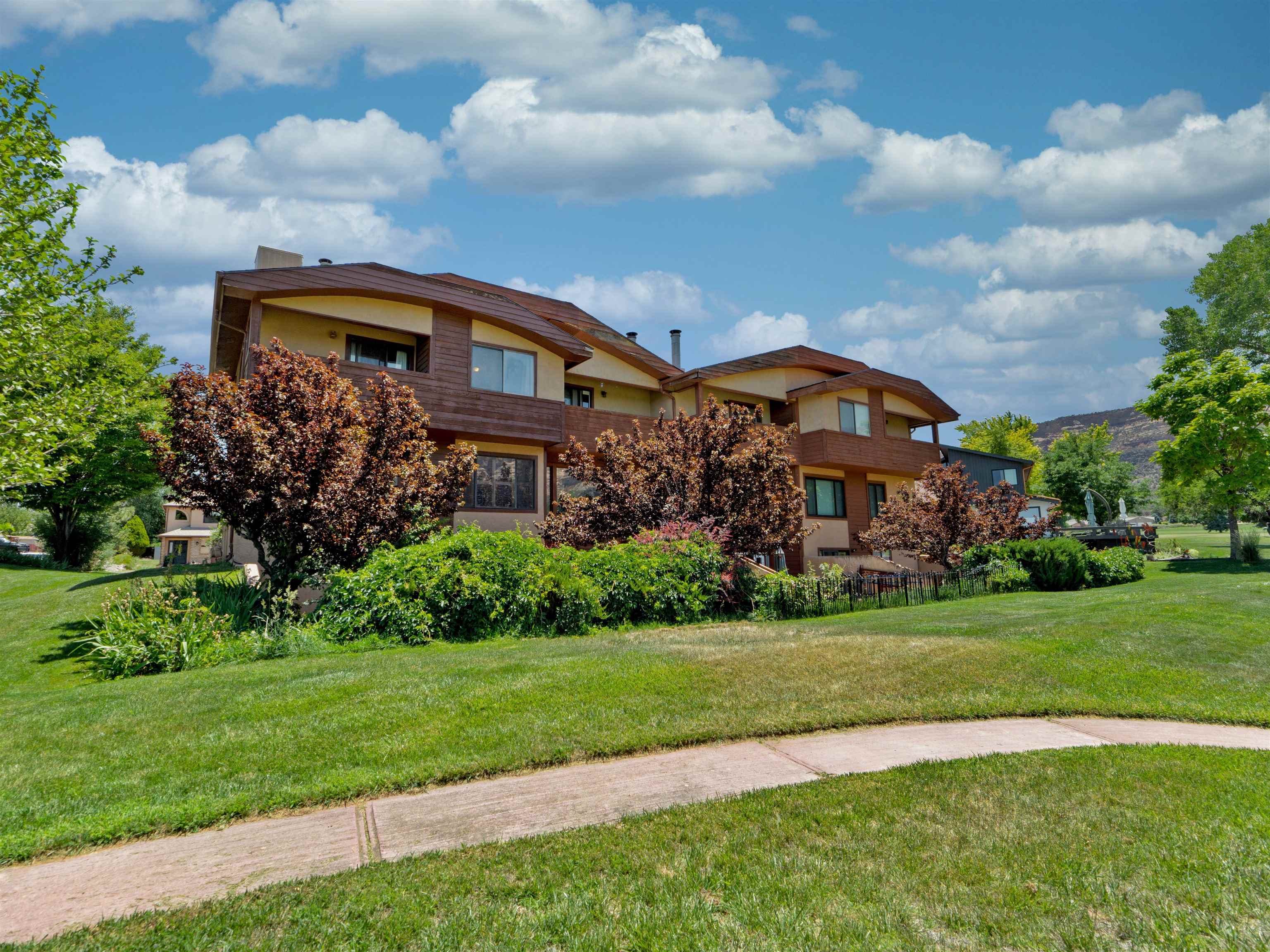 517 Rado Drive, Unit D Grand Junction, CO 81507 - Photo 22 of 24 a front view of a house with a yard