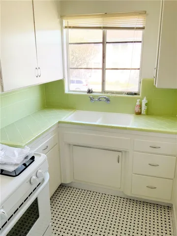 a bathroom with a sink and a window