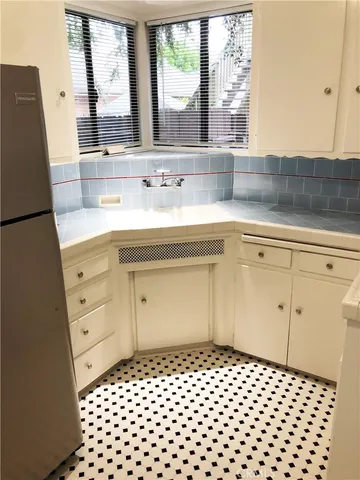 a bathroom with a sink a vanity and a large mirror