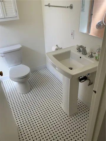 a bathroom with a sink and a toilet