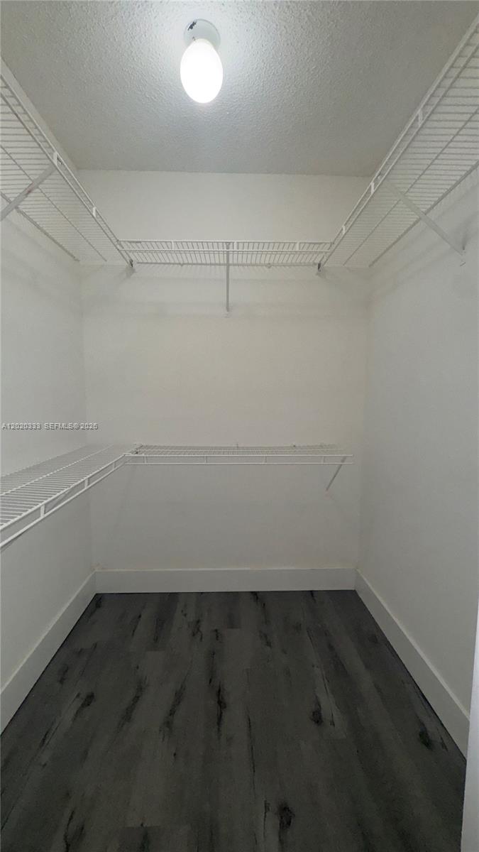 11309 Southwest 200th Street, Unit 103C Miami, FL 33157 - Photo 13 of 18 an empty room with an empty space