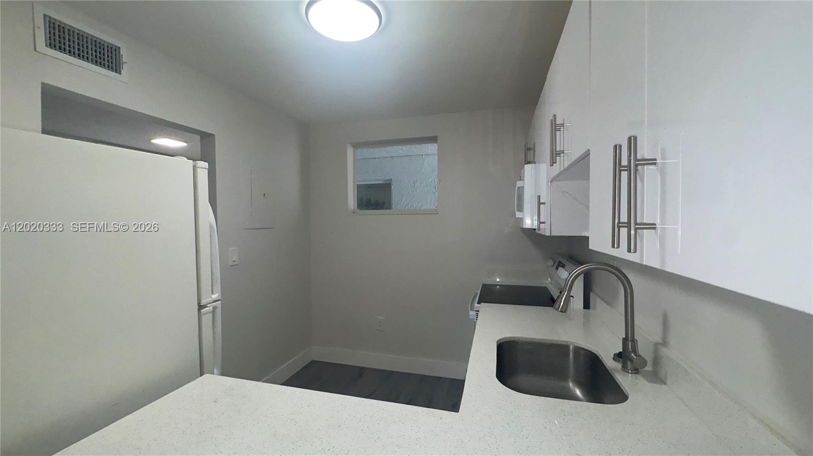 11309 Southwest 200th Street, Unit 103C Miami, FL 33157 - Photo 17 of 18 a bathroom with a sink and a mirror