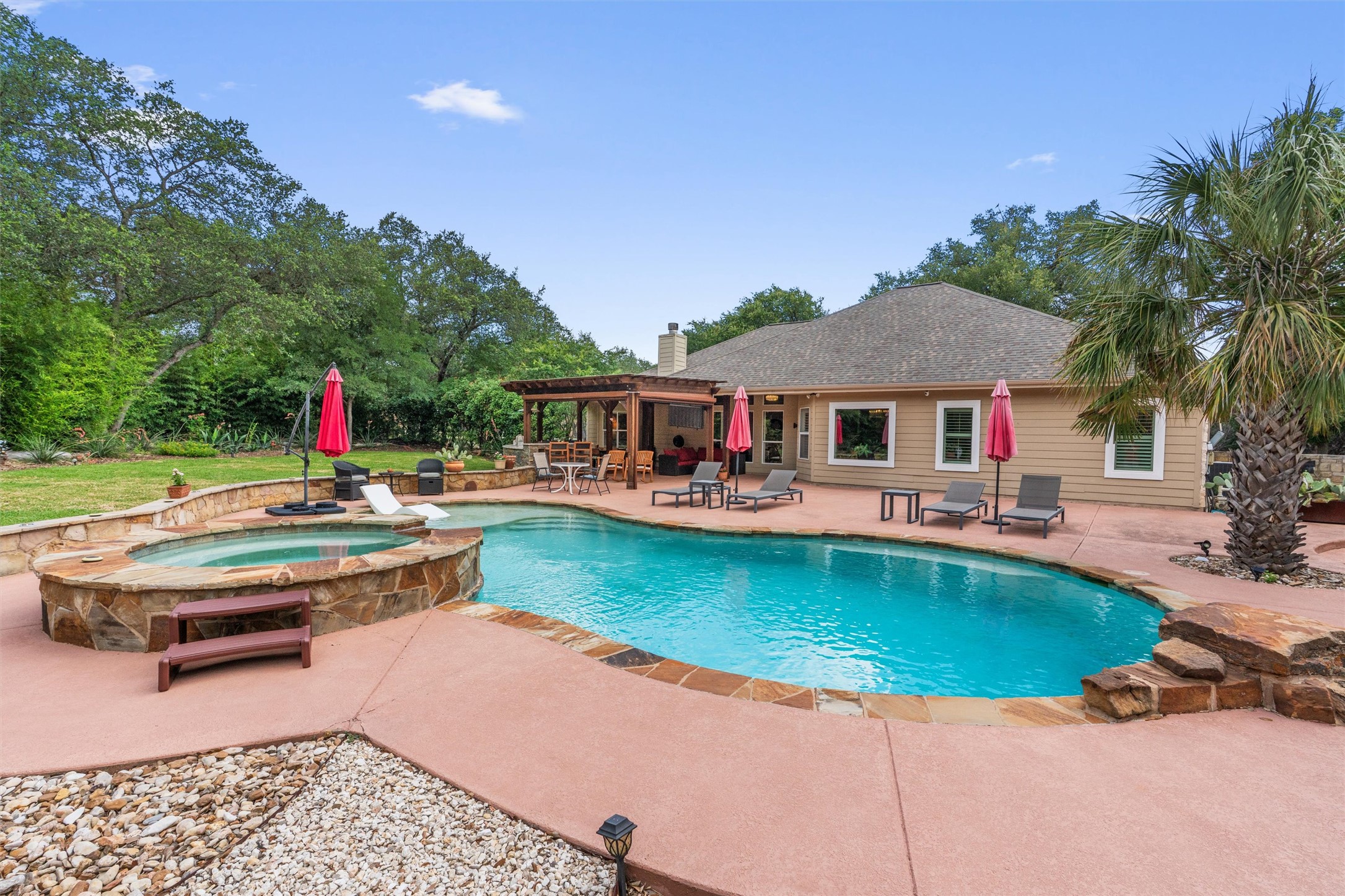 223 East Ridgewood Road Georgetown, TX 78633 - Photo 22 of 40 A spacious outdoor oasis featuring a private pool and spa, perfect for entertaining