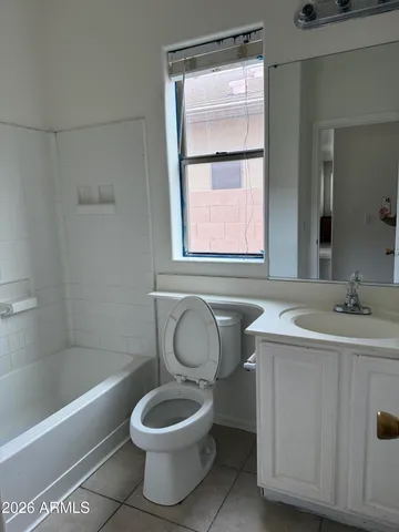 a bathroom with a sink toilet and bathtub