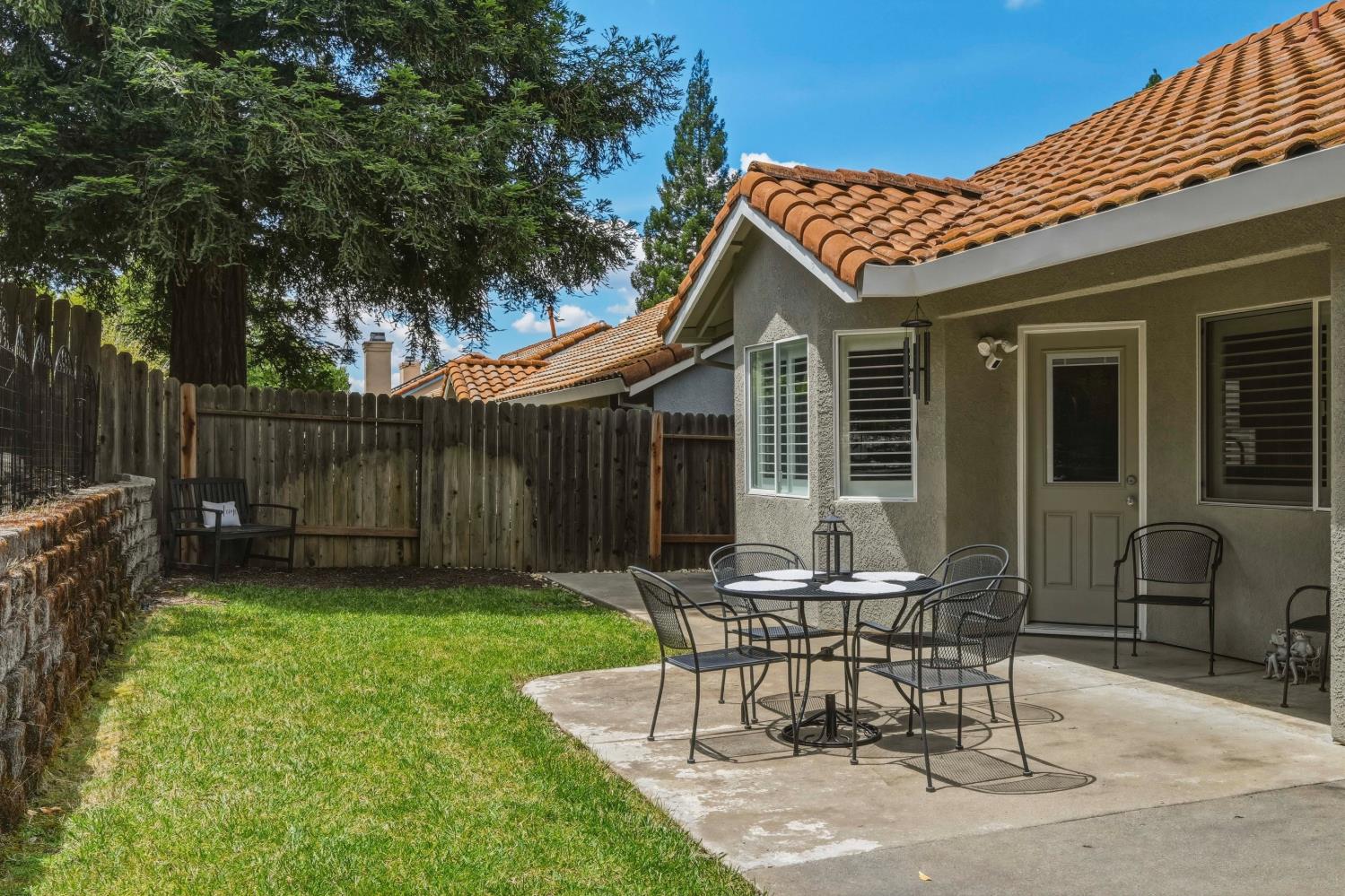 5013 Charter Road Rocklin, CA 95765 - Photo 27 of 35 a view of a house with backyard and a sitting area