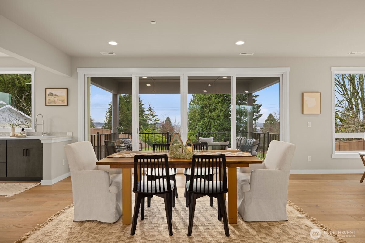 7853 South 132nd Street Seattle, WA 98178 - Photo 18 of 40 a view of a dining room with furniture window and wooden floor