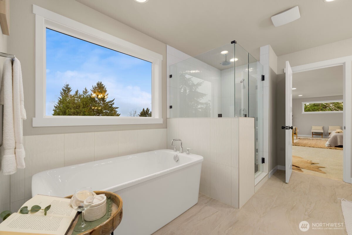 7853 South 132nd Street Seattle, WA 98178 - Photo 25 of 40 a bathroom with a tub and a shower