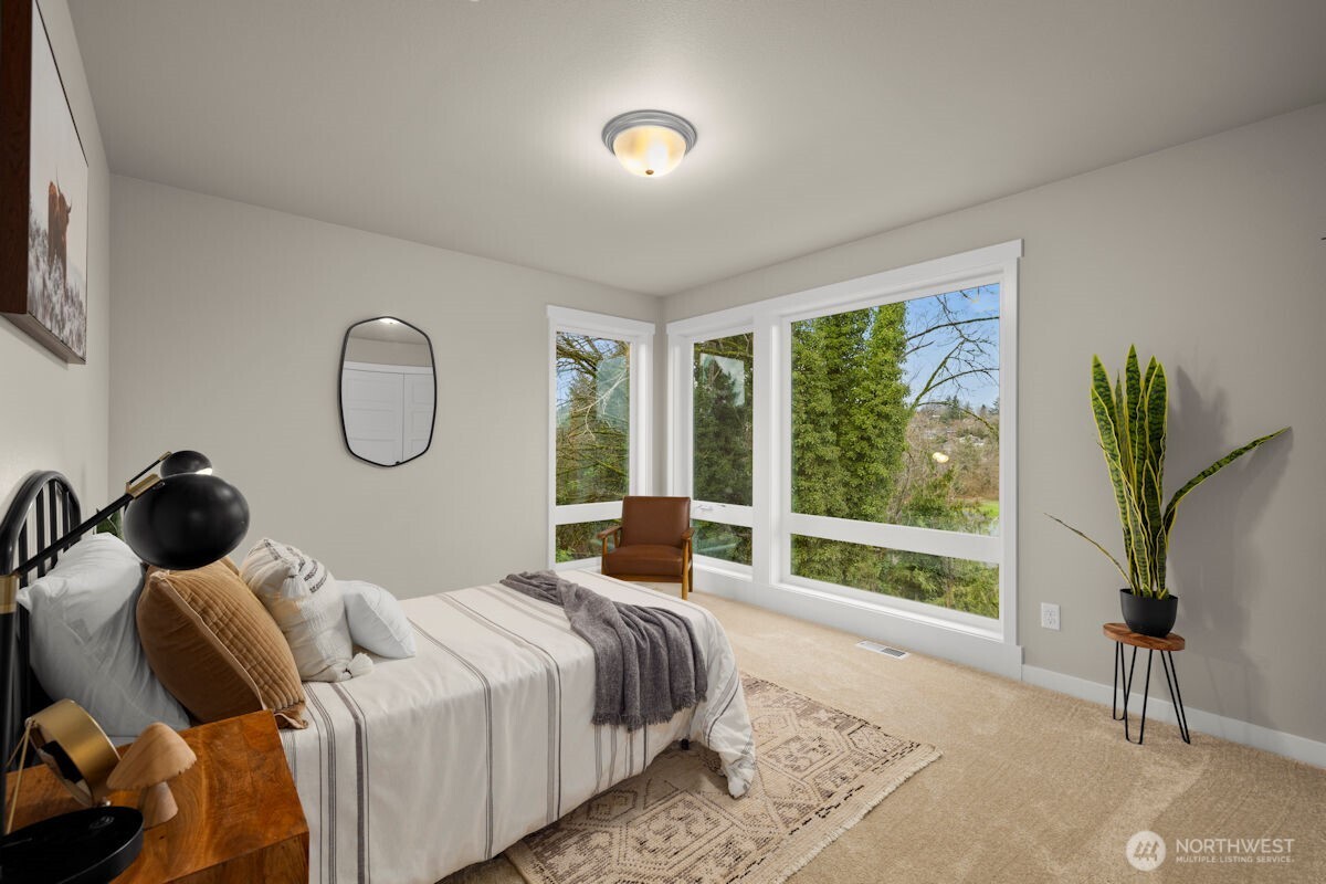 7853 South 132nd Street Seattle, WA 98178 - Photo 29 of 40 a bedroom with bed and a window
