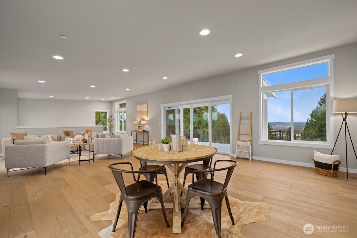 7853 South 132nd Street Seattle, WA 98178 - Photo 32 of 40 a view of a dining room with furniture a rug and wooden floor