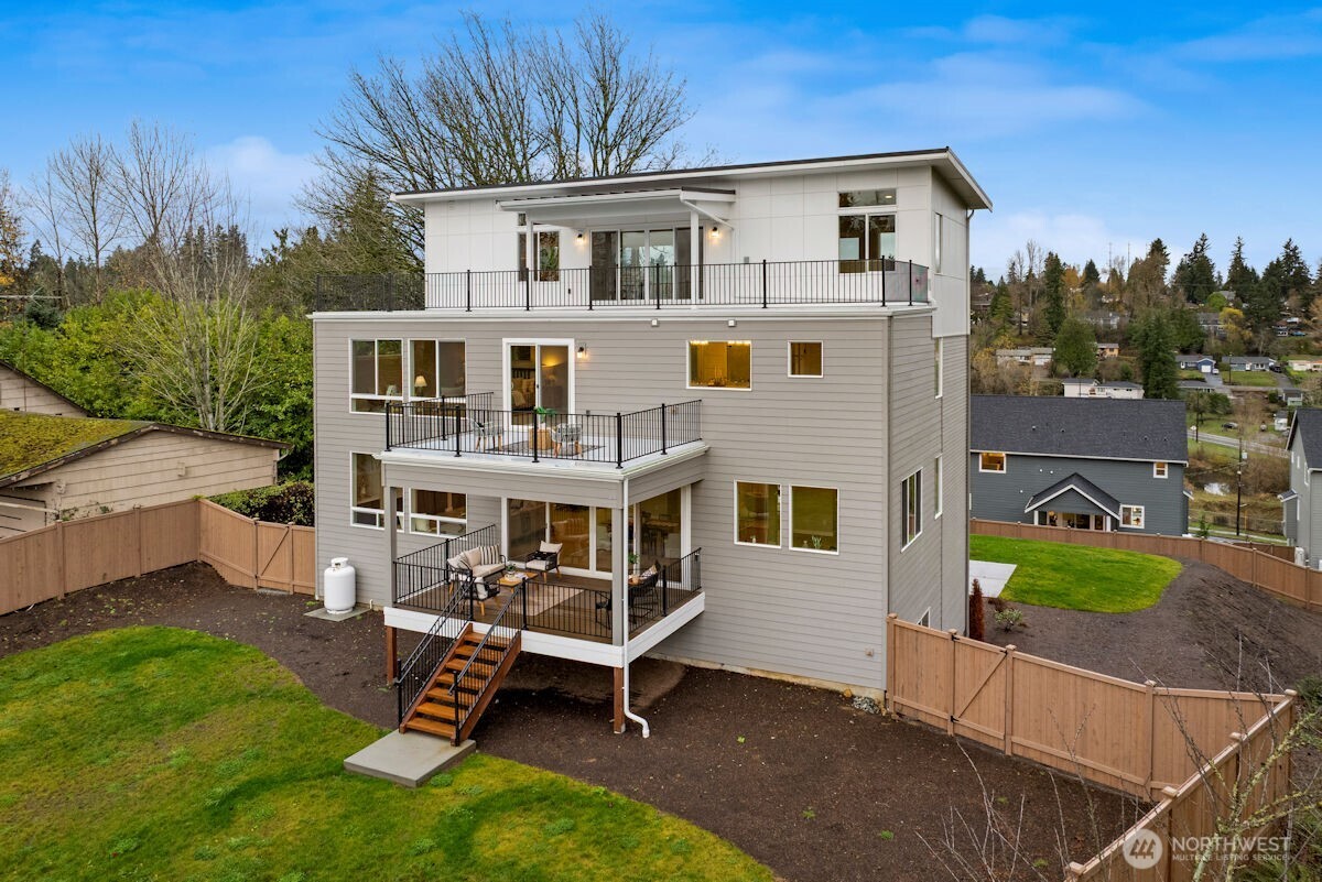 7853 South 132nd Street Seattle, WA 98178 - Photo 39 of 40 a white building with a outdoor space
