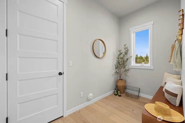 a living room with fireplace furniture and a wooden floor