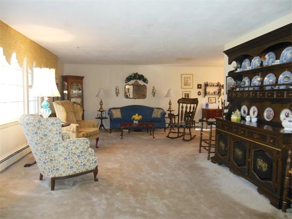 26 Suzanne Road Lexington, MA 02420 - Photo 2 of 11 a living room with furniture and a flat screen tv