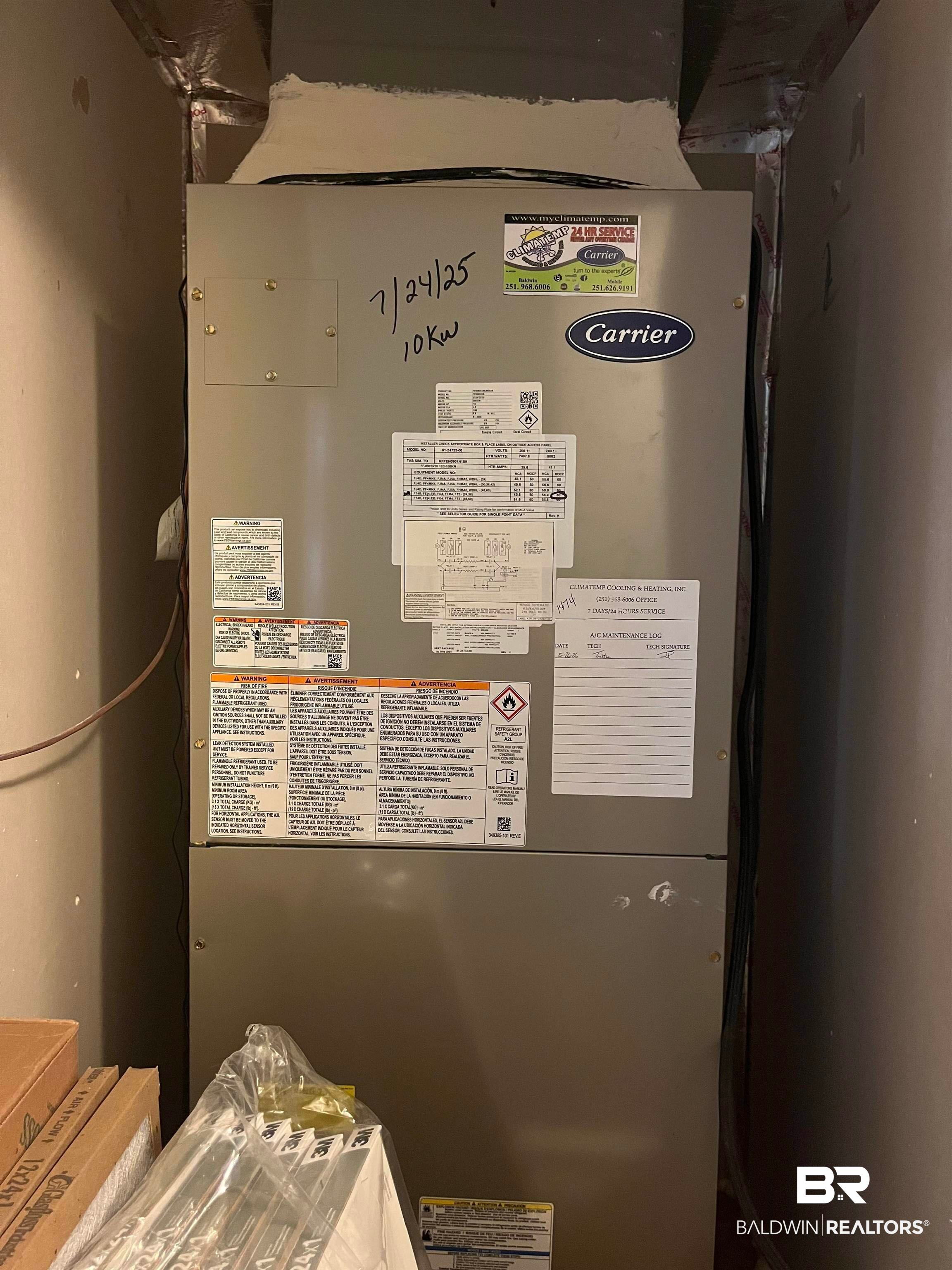 309 Cluster Street Foley, AL 36535 - Photo 27 of 38 HVAC system with Carrier branding and visible maintenance information