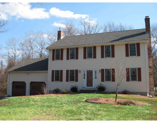 40 Spaulding Road Chelmsford, MA 01824 - Photo 1 of 11 a house that has a big yard in front of it