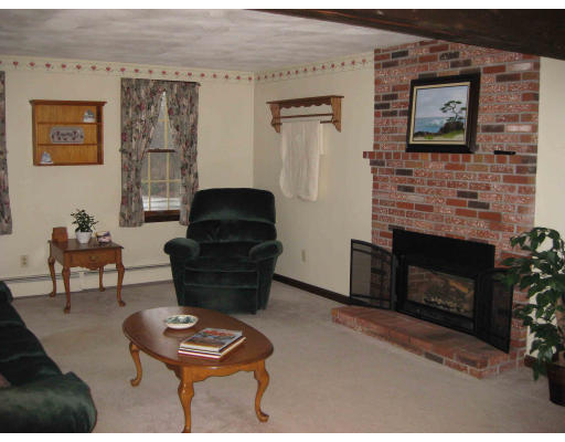 40 Spaulding Road Chelmsford, MA 01824 - Photo 2 of 11 a living room with furniture and a fireplace