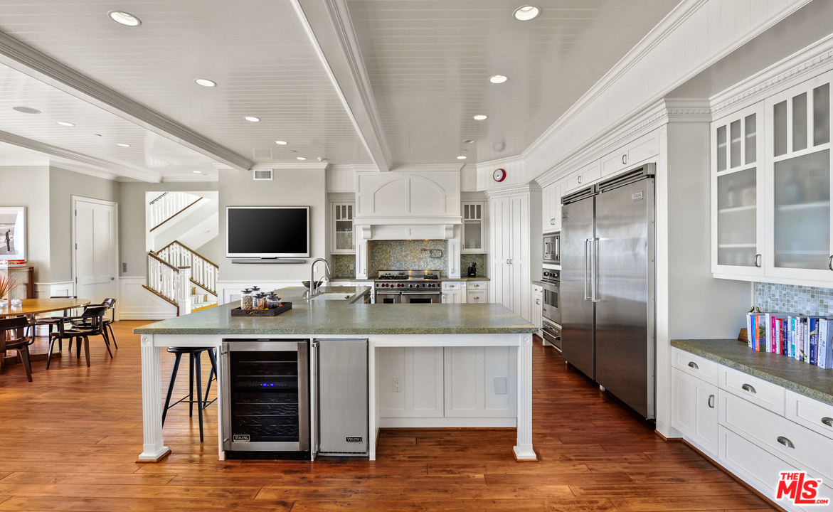 31412 Broad Beach Road Malibu, CA 90265 - Photo 15 of 43 a large kitchen with stainless steel appliances granite countertop a large center island and a refrigerator