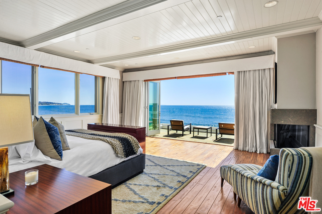 31412 Broad Beach Road Malibu, CA 90265 - Photo 16 of 43 a living room with furniture and floor to ceiling windows