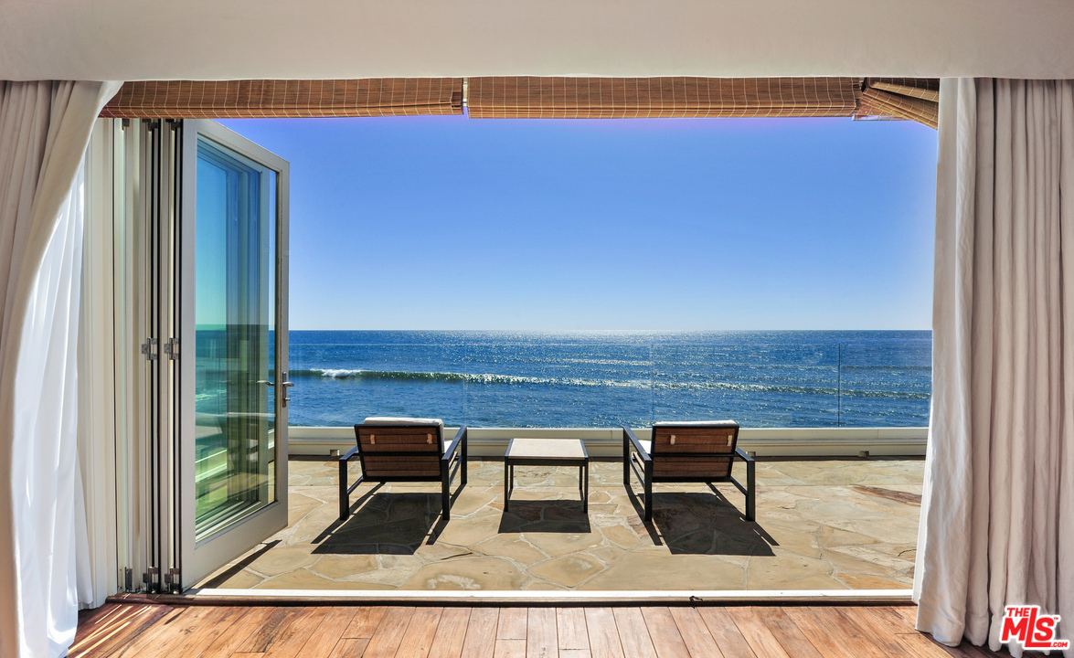 31412 Broad Beach Road Malibu, CA 90265 - Photo 17 of 43 a view of a living room with a table and chairs