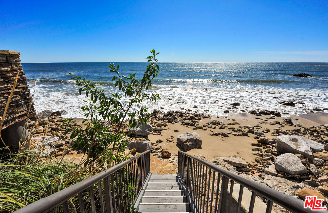 31412 Broad Beach Road Malibu, CA 90265 - Photo 40 of 43 a view of a balcony with wooden floor and fence
