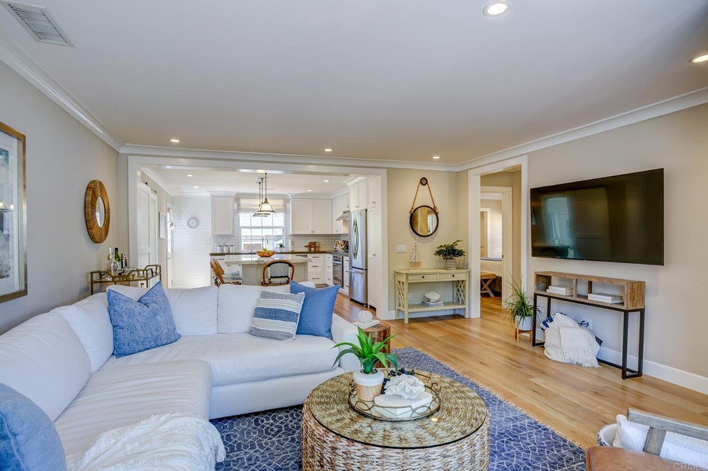 7936 Paseo Del Ocaso La Jolla, CA 92037 - Photo 11 of 43 a living room with furniture and a flat screen tv