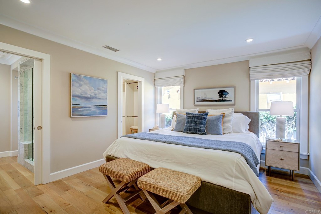 7936 Paseo Del Ocaso La Jolla, CA 92037 - Photo 15 of 43 a bedroom with a bed and wooden floor