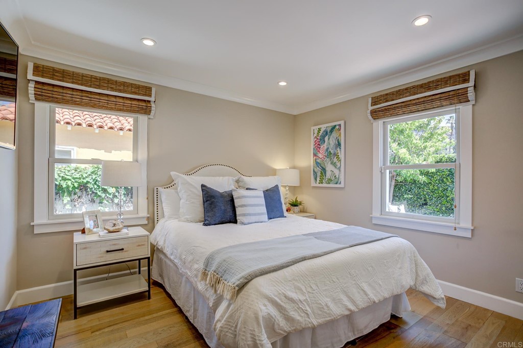 7936 Paseo Del Ocaso La Jolla, CA 92037 - Photo 17 of 43 a large bed sitting in a bedroom next to a window