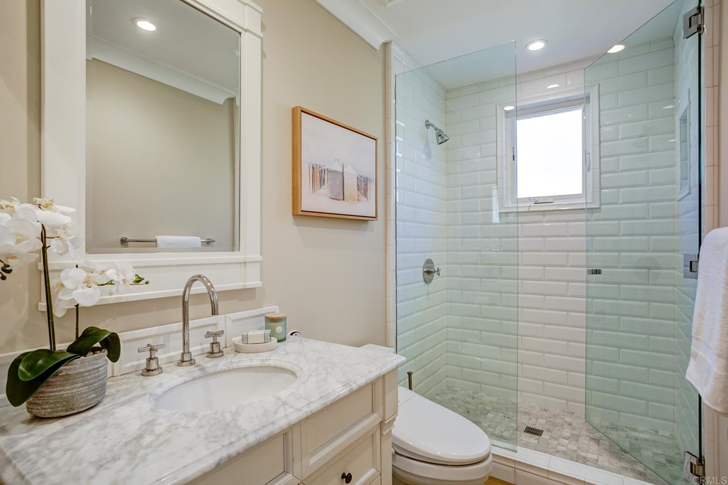 7936 Paseo Del Ocaso La Jolla, CA 92037 - Photo 18 of 43 a bathroom with a granite countertop sink toilet and shower