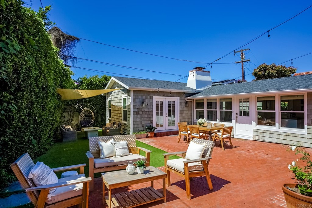 7936 Paseo Del Ocaso La Jolla, CA 92037 - Photo 20 of 43 a view of a house with a swimming pool and sitting area