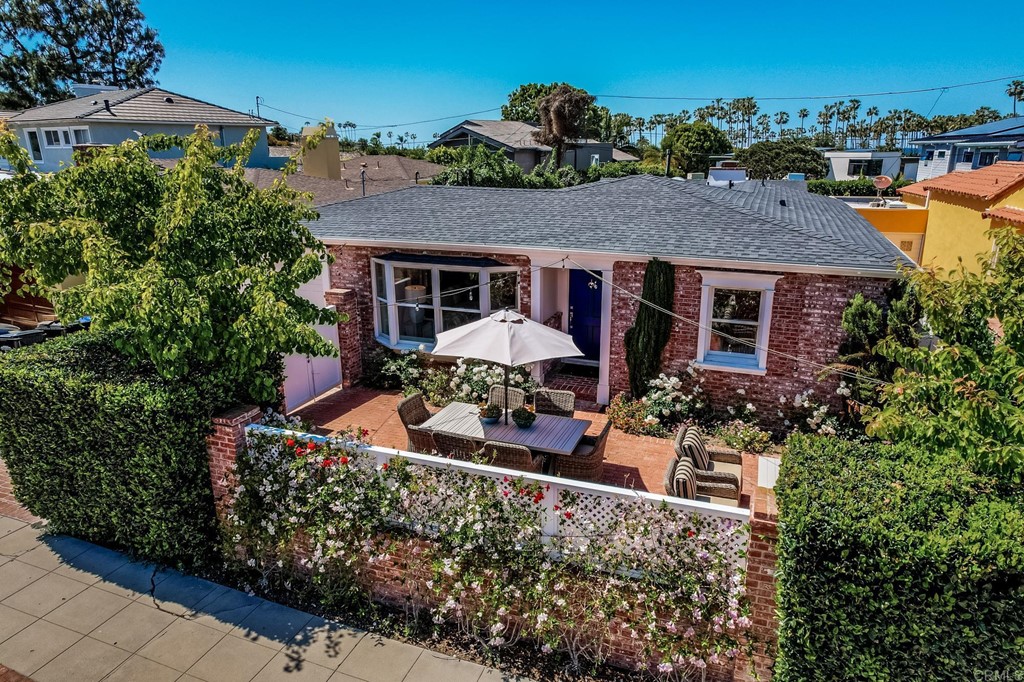 7936 Paseo Del Ocaso La Jolla, CA 92037 - Photo 2 of 43 a view of a house with a yard and potted plants