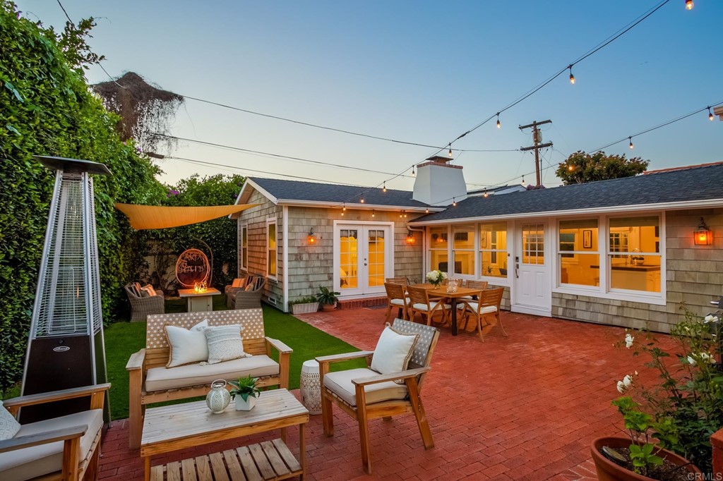 7936 Paseo Del Ocaso La Jolla, CA 92037 - Photo 21 of 43 a living room with patio furniture and a fireplace