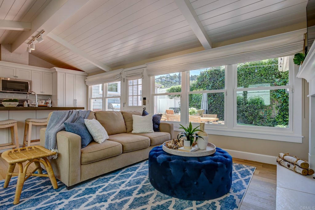 7936 Paseo Del Ocaso La Jolla, CA 92037 - Photo 26 of 43 a living room with furniture and a large window