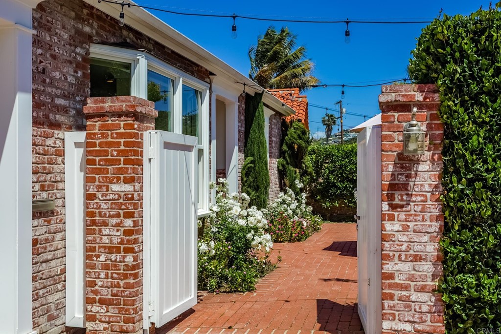 7936 Paseo Del Ocaso La Jolla, CA 92037 - Photo 3 of 43 a view of a house with a flower plants