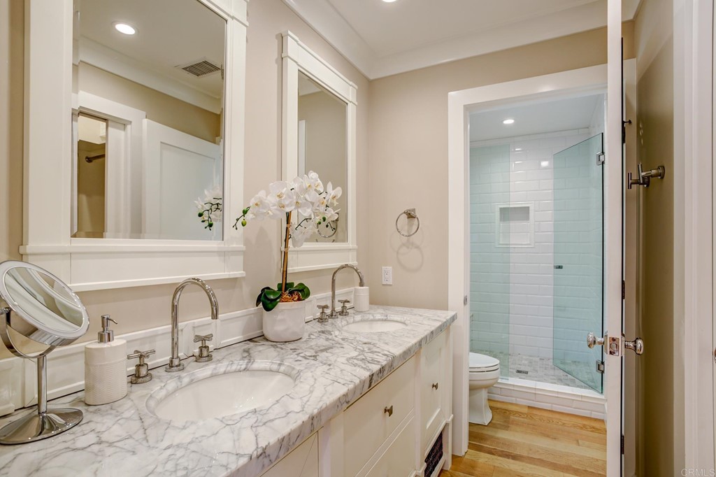 7936 Paseo Del Ocaso La Jolla, CA 92037 - Photo 31 of 43 a bathroom with a granite countertop sink and a mirror