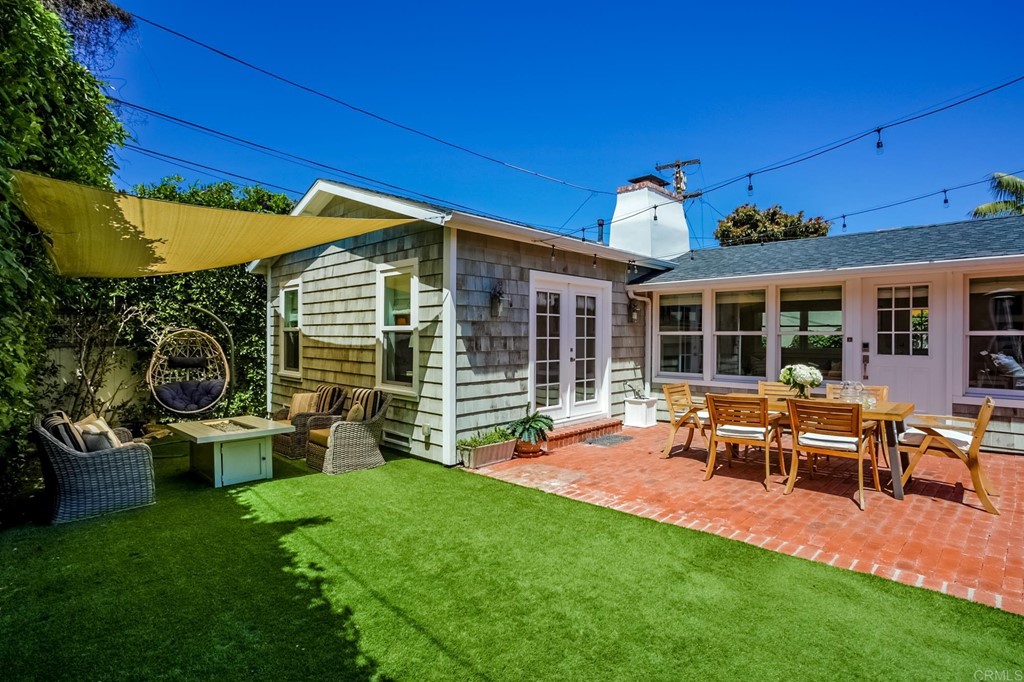 7936 Paseo Del Ocaso La Jolla, CA 92037 - Photo 32 of 43 a view of a house with backyard porch and sitting area