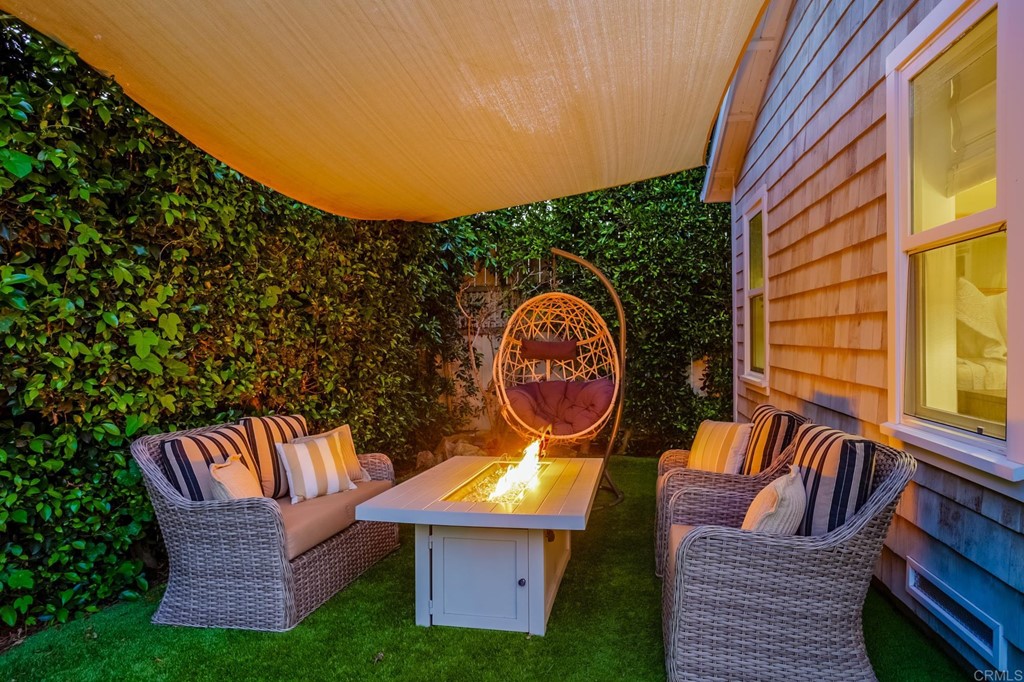 7936 Paseo Del Ocaso La Jolla, CA 92037 - Photo 34 of 43 a backyard of a house with table and chairs