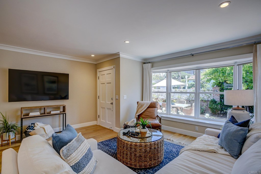 7936 Paseo Del Ocaso La Jolla, CA 92037 - Photo 9 of 43 a living room with furniture and a flat screen tv