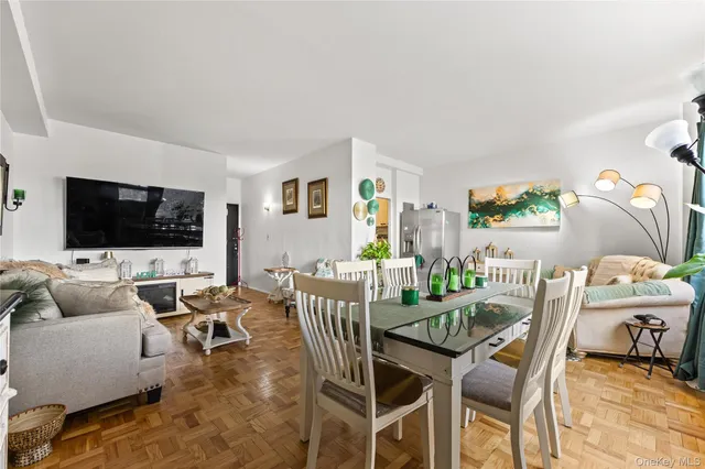 a view of a livingroom with furniture and a flat screen tv
