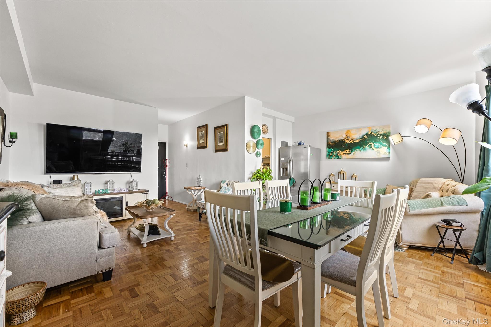 3 Fordham Hill Ovl, Unit 3C Bronx, NY 10468 - Photo 2 of 24 a view of a livingroom with furniture and a flat screen tv