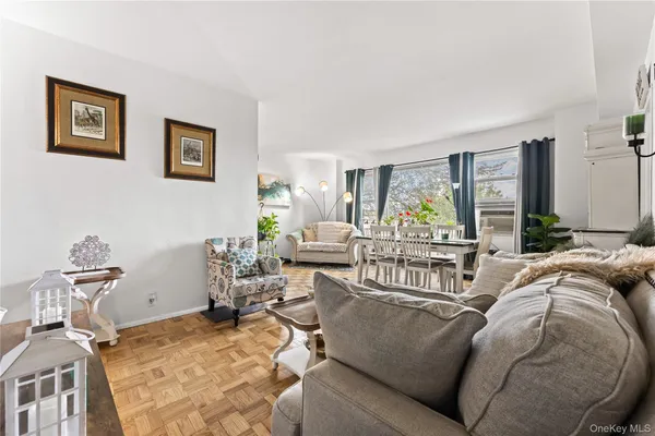 a living room with furniture and large windows
