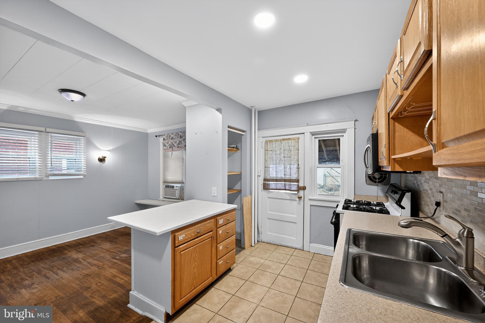 108 South Pearl Street Lancaster, PA 17603 - Photo 11 of 30 a kitchen that has a sink and a stove in it