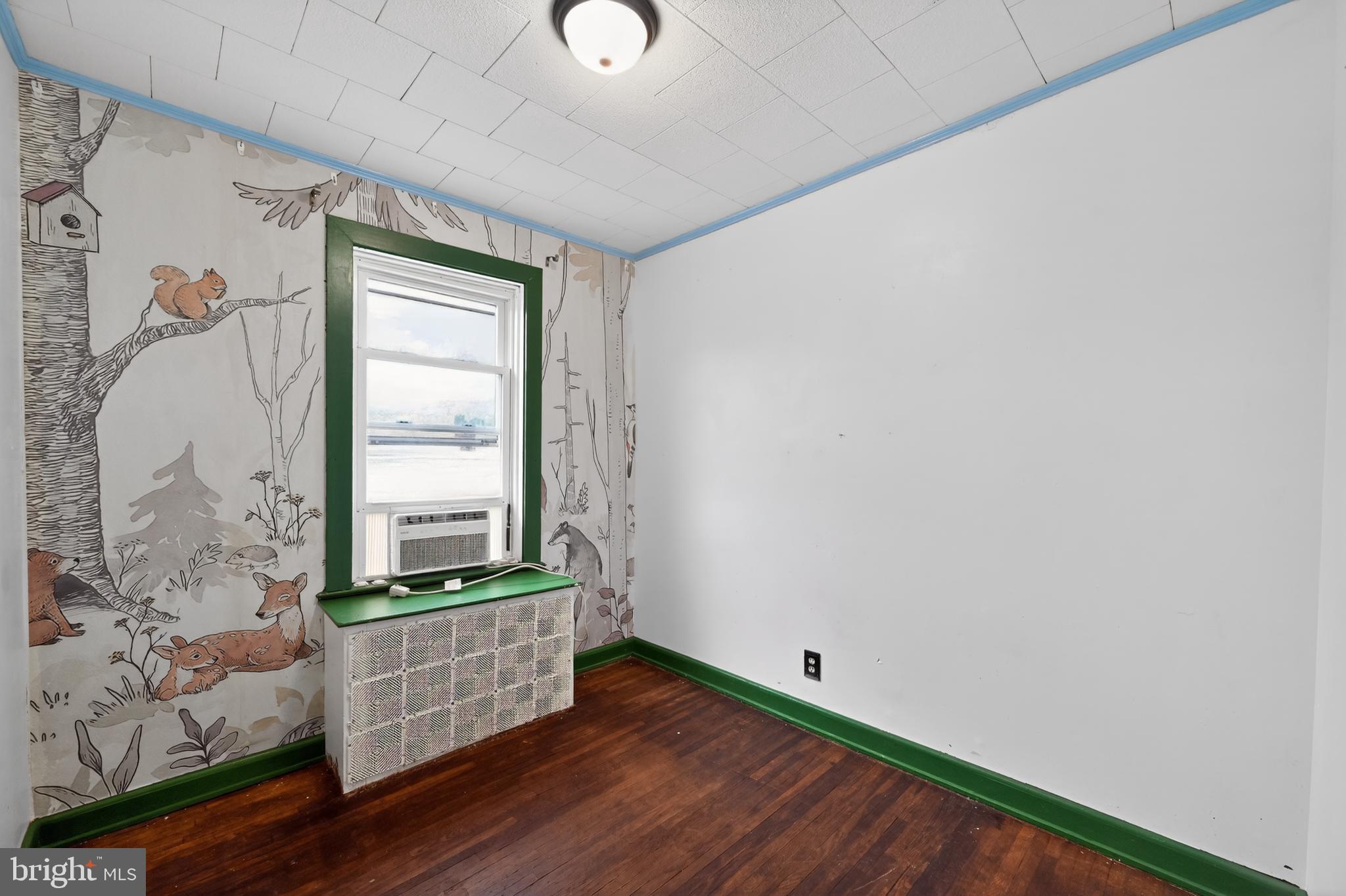 108 South Pearl Street Lancaster, PA 17603 - Photo 16 of 30 a room with wooden floor and white walls